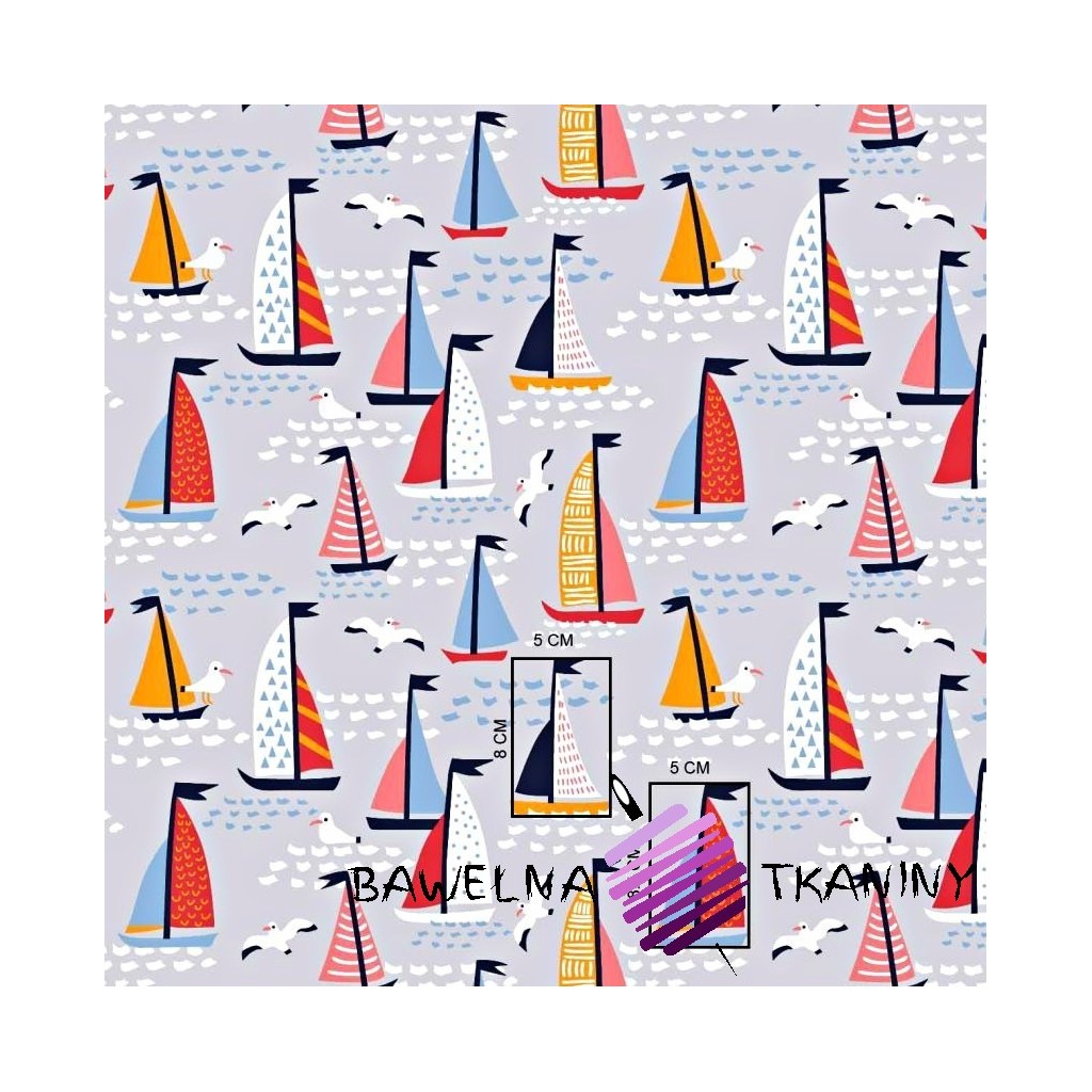 Cotton colorful sailboats on a gray background