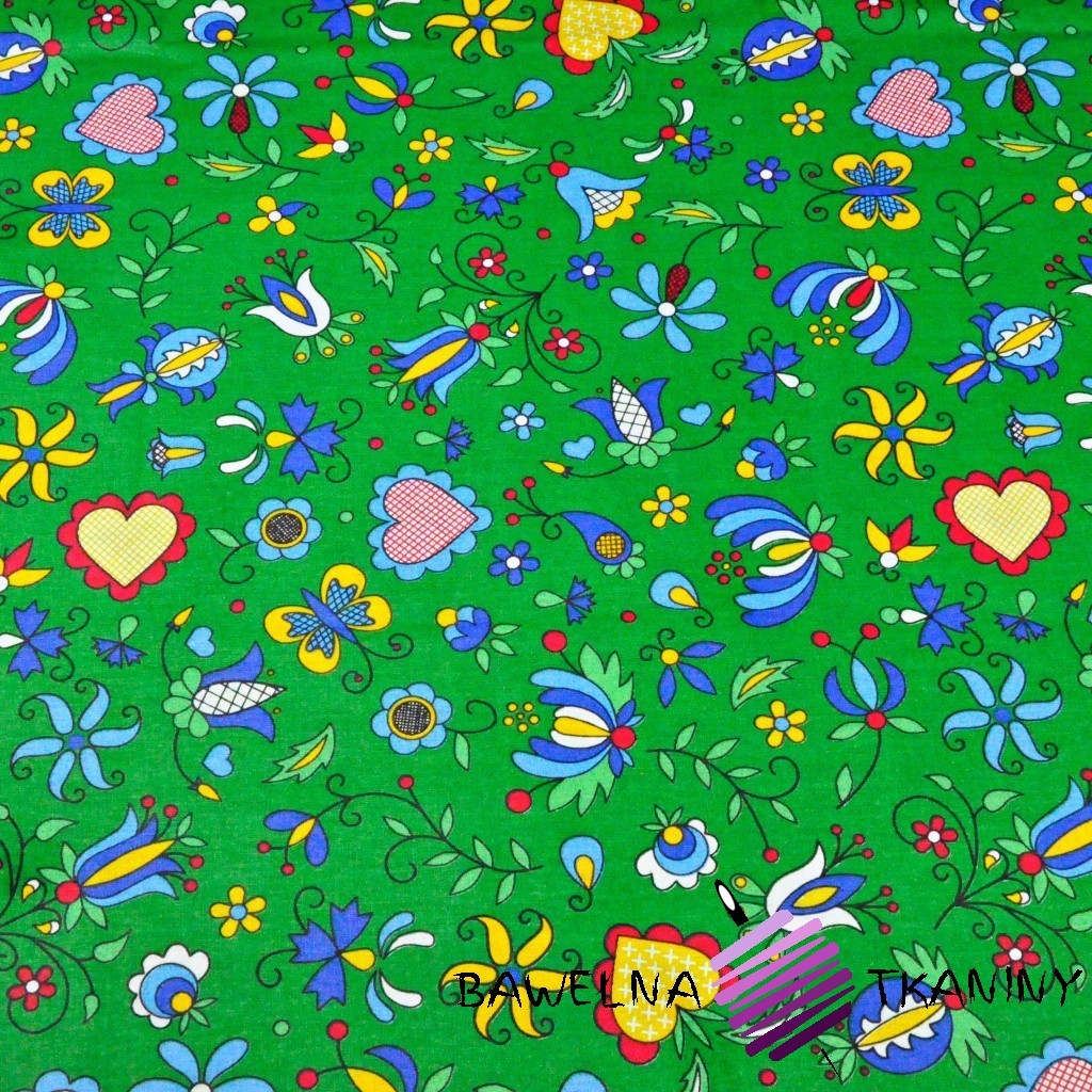 Bawełna wzór kaszubski niebieski na zielonym tle