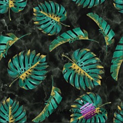 Monstera green-gold leaves on a marble background