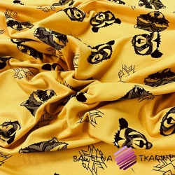 Looped knit - black raccoons on mustard background