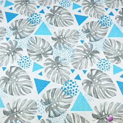 Cotton gray monstera leaves with turquoise triangles on a white background