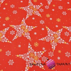 Decorative fabric white and gold stars in snowflakes on a red background