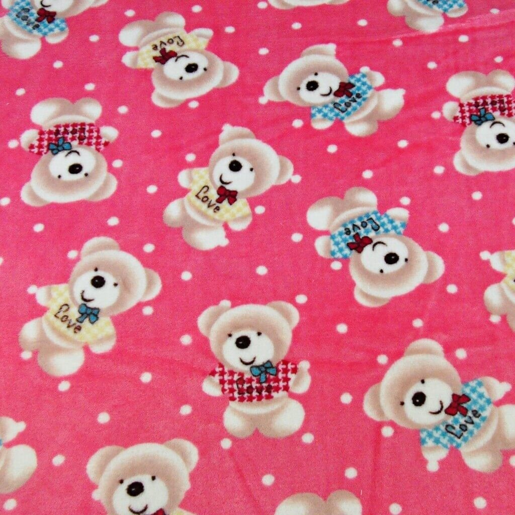 Soft fleece teddy bears on a pink background