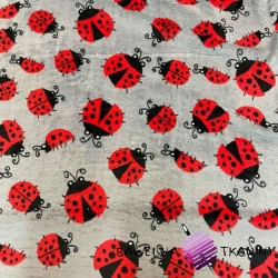Soft fleeece red ladybugs on a gray background