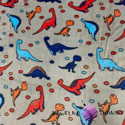Soft fleeece colorful dinosaurs on a gray background