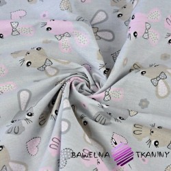 Cotton beige-pink rabbits on a gray background