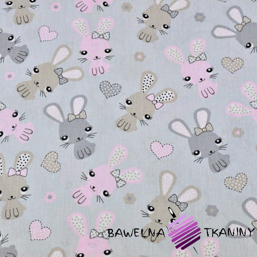 Cotton beige-pink rabbits on a gray background