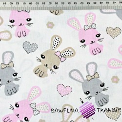 Cotton beige-pink rabbits on a white background
