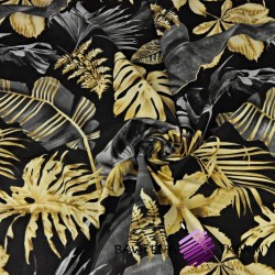 Cotton large, dark gray-gold leaves on a black background